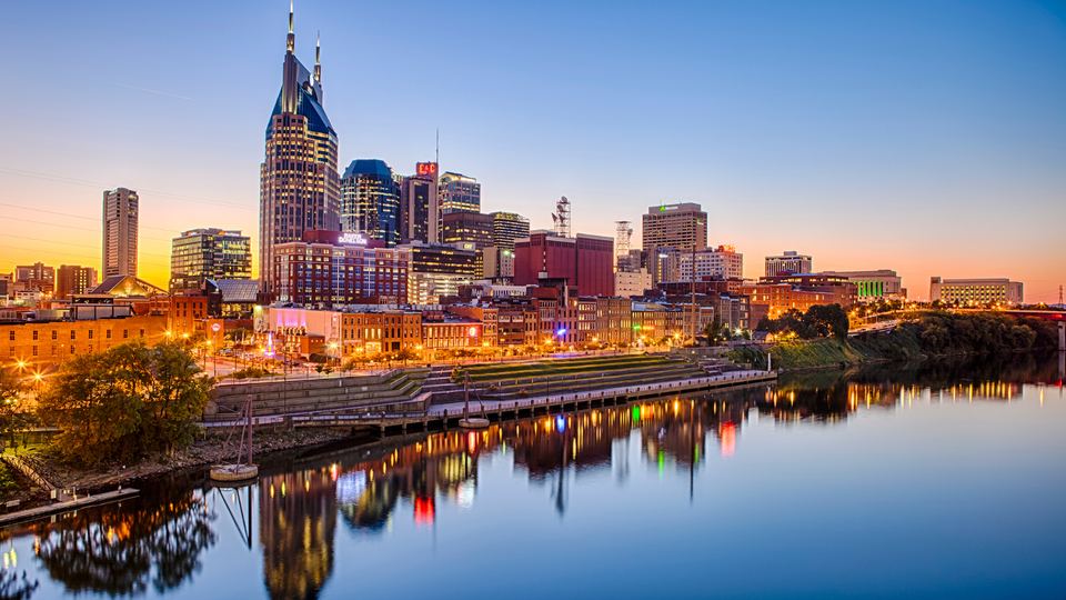 Downtown Nashville skyline at sunset over the Cumberland River
