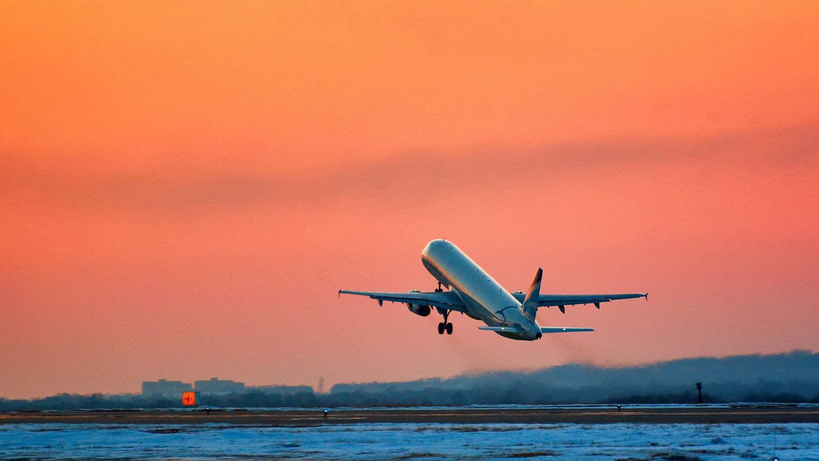 A jet taking off at sunset