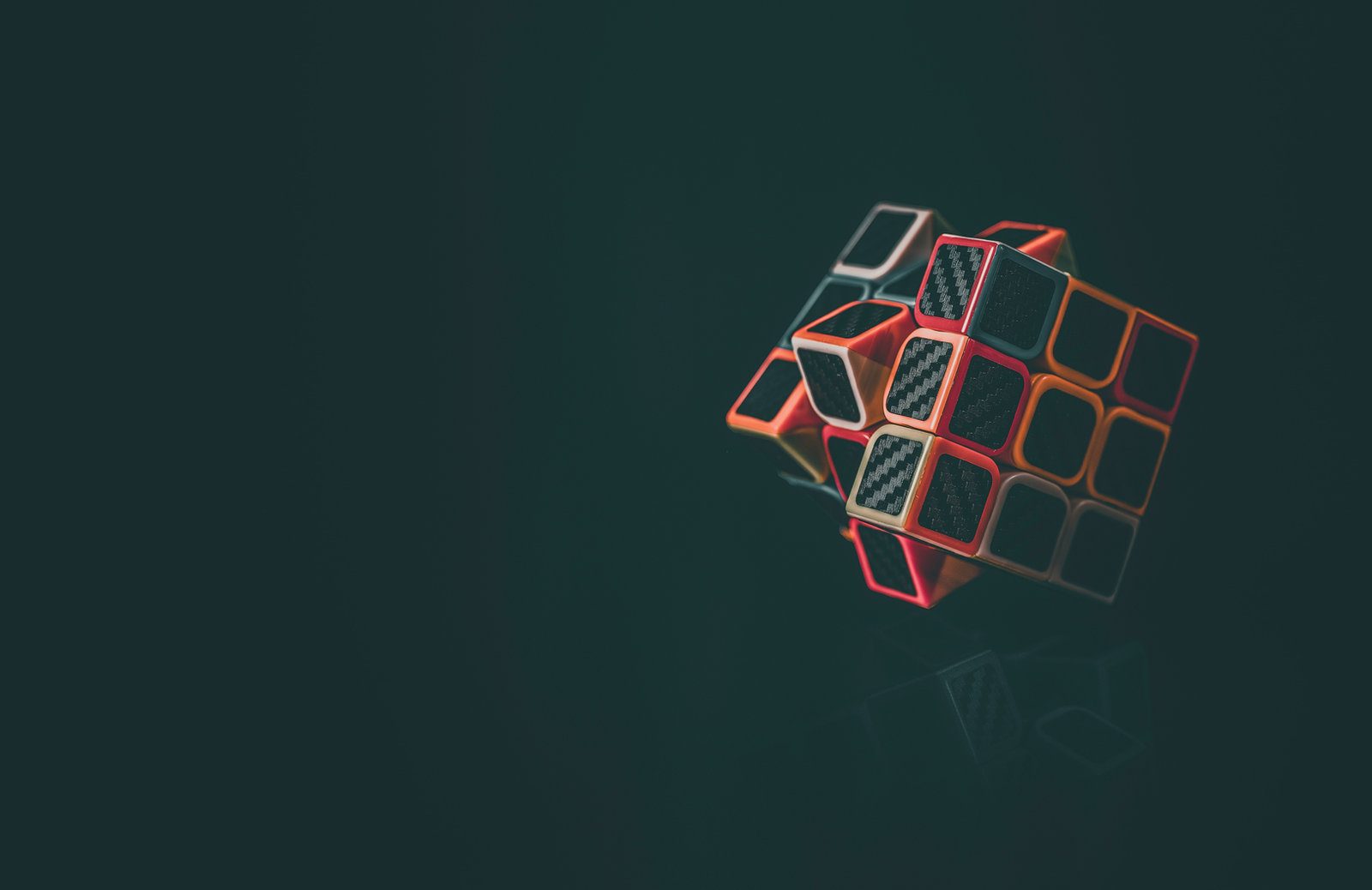 A glowing puzzle cube on a dark background